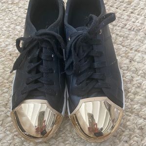 Black canvas sneakers with good metal toe